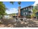 Lakeside backyard with seating area, fire pit, dock and direct water access at 1602 Beachway Ln, Odessa, FL 33556