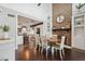 Stylish dining room with a brick fireplace, open layout, seamlessly connected to a modern kitchen at 1602 Beachway Ln, Odessa, FL 33556
