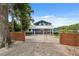 Inviting two-story home featuring a gated entrance, well-maintained landscaping, and charming curb appeal at 1602 Beachway Ln, Odessa, FL 33556