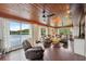 Inviting living room featuring expansive lake views, comfortable seating, and hardwood floors for relaxation at 1602 Beachway Ln, Odessa, FL 33556