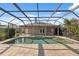 Beautiful pool with a screened enclosure, offering privacy and a relaxing outdoor space at 1623 Crossvine Ct, New Port Richey, FL 34655