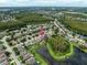 High aerial shot of a house with a pool and pond view in a developed community at 17905 Machair Ln, Land O Lakes, FL 34638