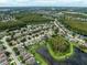 Extensive community aerial view highlighting the neighborhood's layout with lakes and natural areas at 17905 Machair Ln, Land O Lakes, FL 34638