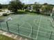 Aerial view of the community basketball court surrounded by a fence at 17905 Machair Ln, Land O Lakes, FL 34638