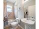 Bathroom featuring a tub and a sink at 17905 Machair Ln, Land O Lakes, FL 34638
