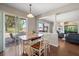 Bright dining area with sliding glass doors leading to the outdoor patio at 17905 Machair Ln, Land O Lakes, FL 34638