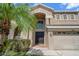 Beautiful home exterior featuring a grand entrance with a striking black door at 17905 Machair Ln, Land O Lakes, FL 34638
