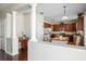 Open concept kitchen with breakfast nook, stainless steel appliances, and wood flooring at 17905 Machair Ln, Land O Lakes, FL 34638