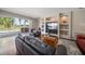 Living room with sliding glass doors to patio, recessed shelving, and comfortable seating at 17905 Machair Ln, Land O Lakes, FL 34638