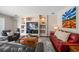 Cozy living room featuring recessed shelving, a TV, and comfortable seating arrangement at 17905 Machair Ln, Land O Lakes, FL 34638