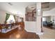 Open-concept living space with hardwood floors seamlessly connects living and dining areas at 17905 Machair Ln, Land O Lakes, FL 34638