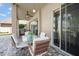 Covered patio with outdoor dining area, ceiling fan, and view of the landscaped backyard at 17905 Machair Ln, Land O Lakes, FL 34638