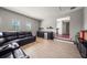 Home theater featuring a large sofa and mini bar at 17905 Machair Ln, Land O Lakes, FL 34638