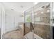 Bright bathroom features a soaking tub with tile surround and a separate glass enclosed shower at 18566 Hunters Meadow Walk, Land O Lakes, FL 34638