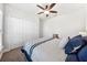 Cozy bedroom featuring carpet flooring, a ceiling fan, a closet and a natural light window at 18566 Hunters Meadow Walk, Land O Lakes, FL 34638
