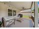 Covered patio featuring outdoor furniture, a ceiling fan, and a grill at 18566 Hunters Meadow Walk, Land O Lakes, FL 34638
