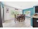 Dining room with tile flooring and a large table with seating for six at 18566 Hunters Meadow Walk, Land O Lakes, FL 34638