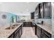Well-lit kitchen with granite countertops, stainless appliances, and eat-in dining at 18566 Hunters Meadow Walk, Land O Lakes, FL 34638