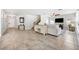 Spacious living room features tile flooring, staircase, and entertainment area with modern decor at 18566 Hunters Meadow Walk, Land O Lakes, FL 34638