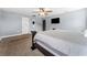 Spacious main bedroom features a ceiling fan, TV, and neutral wall paint at 18566 Hunters Meadow Walk, Land O Lakes, FL 34638