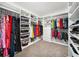 Large walk-in closet with custom shelving and hanging areas for maximum storage at 18566 Hunters Meadow Walk, Land O Lakes, FL 34638