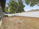 Spacious backyard with a white fence at 18916 New Passage Blvd, Land O Lakes, FL 34638