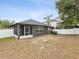 Backyard with screened in porch and privacy fence at 18916 New Passage Blvd, Land O Lakes, FL 34638
