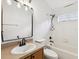 Bright bathroom features a shower and tub combination with updated faucet and sink at 18916 New Passage Blvd, Land O Lakes, FL 34638
