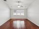 Open bedroom featuring a ceiling fan and multiple windows at 18916 New Passage Blvd, Land O Lakes, FL 34638