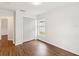 A cozy bedroom with wood flooring and a double door closet at 18916 New Passage Blvd, Land O Lakes, FL 34638