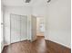 Bright bedroom with a closet and a connecting door to another room at 18916 New Passage Blvd, Land O Lakes, FL 34638