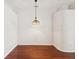 Bright dining room features a pendant light and lovely hardwood floors at 18916 New Passage Blvd, Land O Lakes, FL 34638