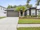 Beautiful single-story home with well-maintained landscaping and a two-car garage at 18916 New Passage Blvd, Land O Lakes, FL 34638