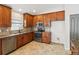 Spacious kitchen featuring granite countertops, stainless steel appliances and tile backsplash at 18916 New Passage Blvd, Land O Lakes, FL 34638