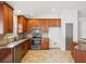 Beautiful kitchen features granite countertops, stainless appliances and ample cabinet space at 18916 New Passage Blvd, Land O Lakes, FL 34638