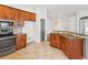 Open kitchen features granite counters and stainless steel appliances at 18916 New Passage Blvd, Land O Lakes, FL 34638