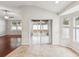 Bright sunroom with tile floor, large windows, and sliding glass doors leading to the outside at 18916 New Passage Blvd, Land O Lakes, FL 34638