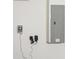 Shot of a gray electrical panel and other electric components on a white wall at 18916 New Passage Blvd, Land O Lakes, FL 34638