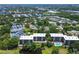 This aerial view showcases the condo community and its beautiful landscaping and swimming pool at 1934 Golfview Dr # 1934, Tarpon Springs, FL 34689