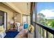 Cozy balcony featuring comfortable seating and open views of the well manicured grounds beyond the property at 1934 Golfview Dr # 1934, Tarpon Springs, FL 34689