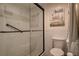 Modern bathroom features glass-enclosed shower, white subway tile, and stylish fixtures at 1934 Golfview Dr # 1934, Tarpon Springs, FL 34689