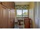 Cozy breakfast nook with natural light, storage cabinets and a charming view at 1934 Golfview Dr # 1934, Tarpon Springs, FL 34689