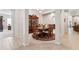 Spacious dining room with ornate wood furniture, tile flooring, and elegant decor at 19531 Mossy Oak Ct, Brooksville, FL 34601