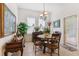 Eat-in dining room with a table for four and natural light from a double window at 19531 Mossy Oak Ct, Brooksville, FL 34601
