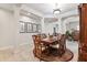 Formal dining room featuring a decorative rug, ornate furniture, and elegant wall decor at 19531 Mossy Oak Ct, Brooksville, FL 34601
