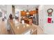 Well-lit kitchen featuring granite countertops, stainless steel appliances, and wooden cabinetry at 19531 Mossy Oak Ct, Brooksville, FL 34601