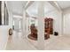 Open-concept living space with tile flooring, columns, dining table, and plenty of natural light at 19531 Mossy Oak Ct, Brooksville, FL 34601