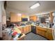 Traditional kitchen with wooden cabinetry and a built-in microwave at 2016 Woodward Ave, Dunedin, FL 34698
