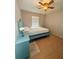 Small bedroom showcasing a ceiling fan, beige walls, and tile floor at 2234 Marietta Ave, Spring Hill, FL 34608