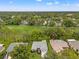 A beautiful property adjacent to the golf course, surrounded by lush greenery and mature trees at 2310 Augusta Dr, Spring Hill, FL 34606